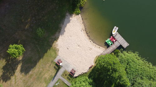 High angle view of people walking on grassy field