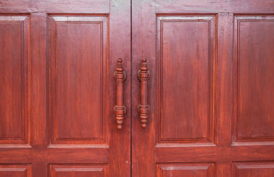 Close-up of closed wooden door of building