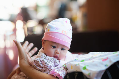 Portrait of cute baby girl at home