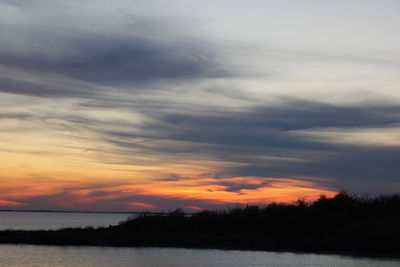 Scenic view of silhouette trees against sky during sunset