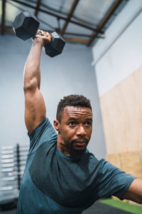 Male athlete exercising in gym