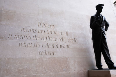 Statue of text on wall