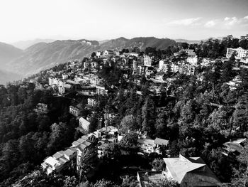 Panoramic view of trees and mountains against sky