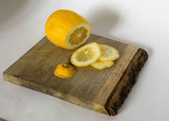 Sliced lemon slices on a wooden pallet, juicy and fresh lemon, a source of vitamins