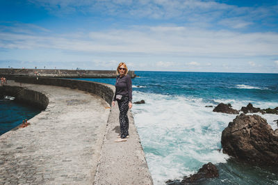 Woman standing on beach