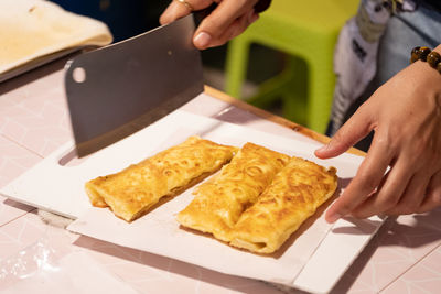 High angle view of woman preparing food on table