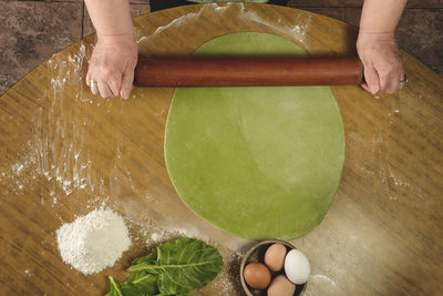 High angle view of person preparing food on table