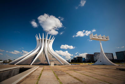 Low angle view of building against cloudy sky