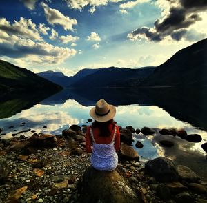 Scenic view of lake and rocks against sky