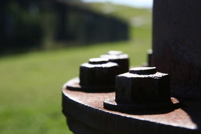 Close-up of nut and bolt on sunny day