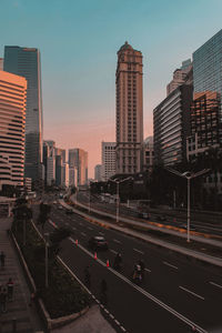 View of city street and buildings against sky