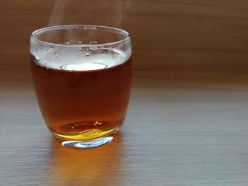 Close-up of beer glass on table