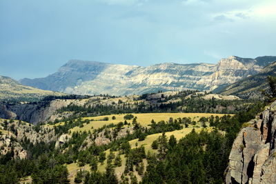 Scenic view of landscape and mountains against sky