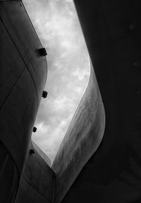 Low angle view of building against cloudy sky