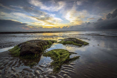 Scenic view of sea against sky at sunset