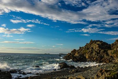 Scenic view of beach and sea against sky