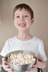 Portrait of smiling boy holding ice cream