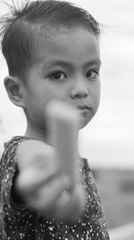 Close-up portrait of cute boy looking away