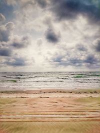 Scenic view of beach against sky