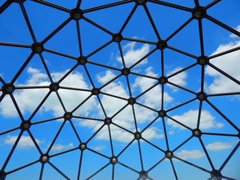 Full frame shot of metallic structure against blue sky