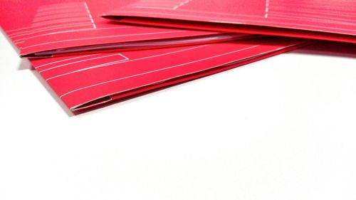 Close-up of red balloon over white background