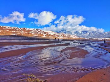 Idyllic shot of stream at great sand dunes national park and preserve against sky