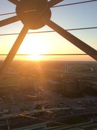 Aerial view of cityscape against sky during sunset
