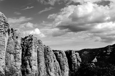 Low angle view of rock formation against sky