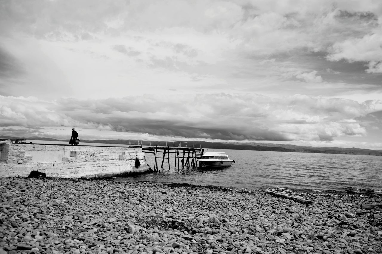 water, sea, cloud - sky, sky, nautical vessel, tranquil scene, transportation, tranquility, scenics, nature, beauty in nature, mode of transport, day, outdoors, horizon over water, beach, sand, no people