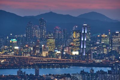 Illuminated buildings in city at night