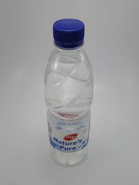 Close-up of water bottle against white background