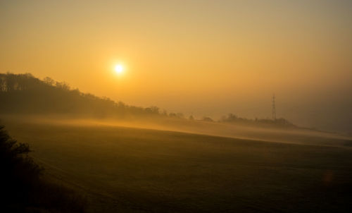 Scenic view of landscape against sky during sunset