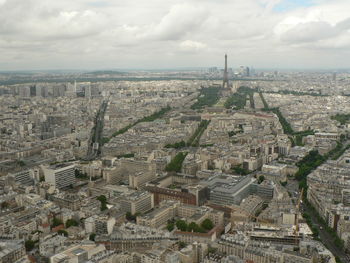 High angle view of cityscape against cloudy sky