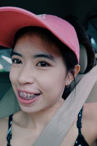 Close-up portrait of a smiling young woman