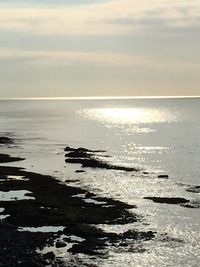 Scenic view of sea at sunset
