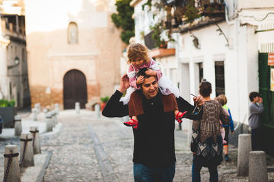Woman standing in front of building
