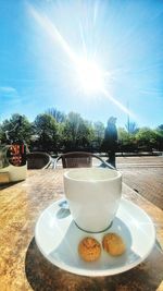 Close-up of breakfast on table against sky