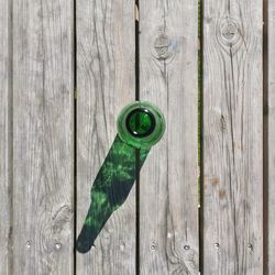 Directly above shot of green chili peppers on wooden plank