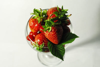 Close-up of strawberry over white background