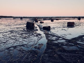 Scenic view of sea against clear sky during sunset