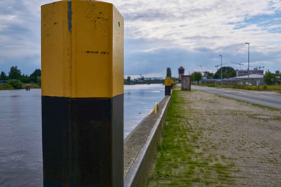Close-up of yellow by sea against sky