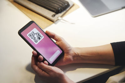 Woman's hands holding cell phone