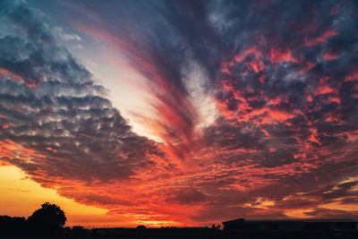 Low angle view of dramatic sky during sunset