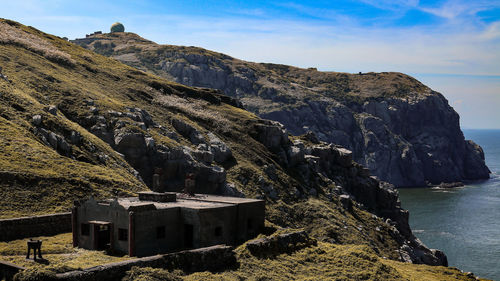 Panoramic view of sea and rock formation against sky