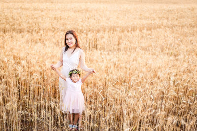 Young woman standing on field