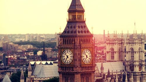 Big ben with cityscape against clear sky 
