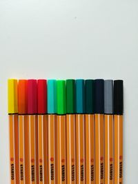 Close-up of multi colored pencils on white background