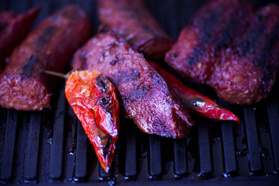 Close-up of meat on barbecue grill