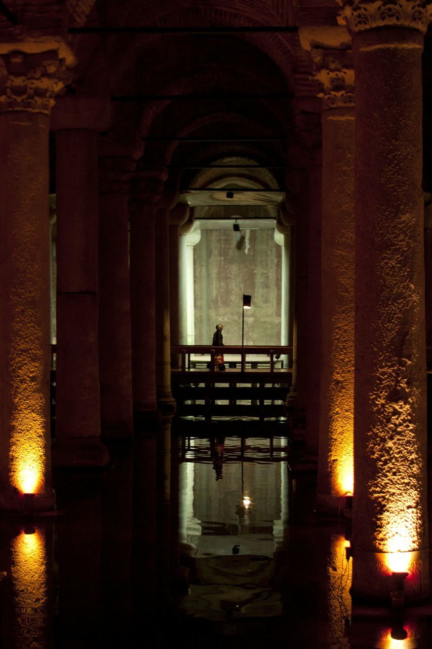 indoors, silhouette, architecture, built structure, arch, men, lifestyles, dark, leisure activity, window, full length, standing, sunlight, reflection, person, sitting, sunset, entrance