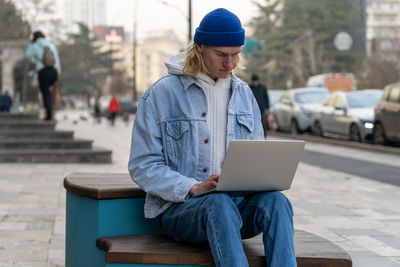 Young woman using laptop at home